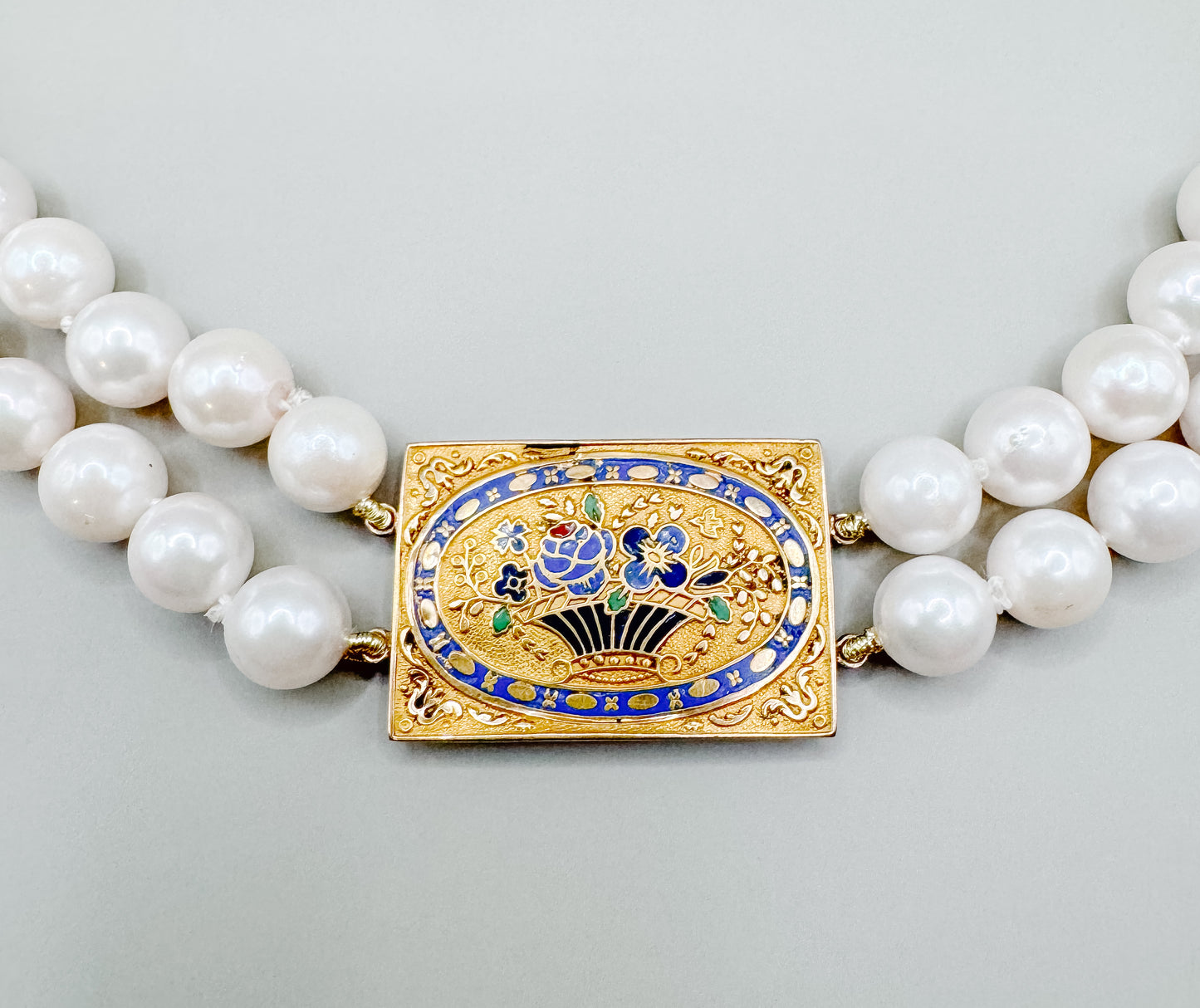 French antique gold clasp necklace on double strand of pearls