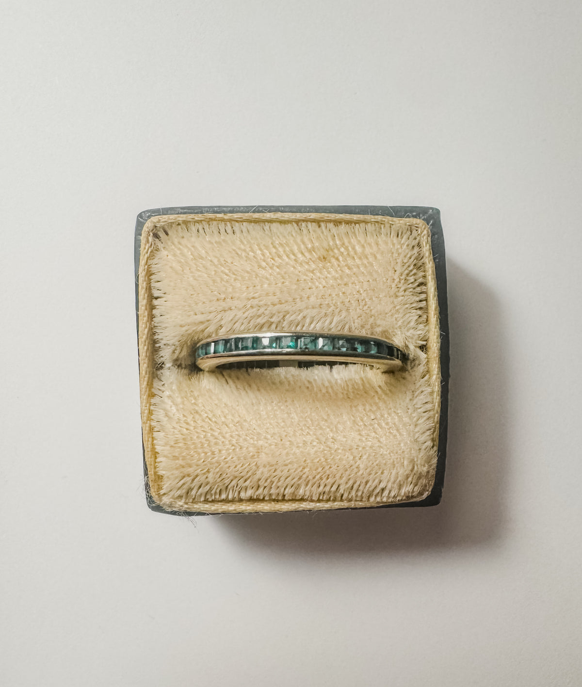 Platinum Channel-Set Emerald Band